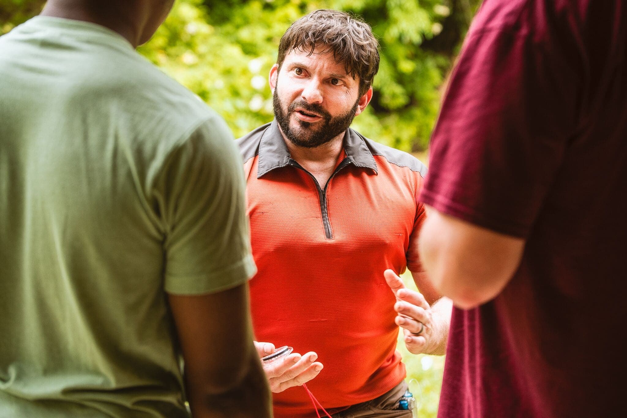 SMG co-founder Clayton LaPrees briefing a group outdoors